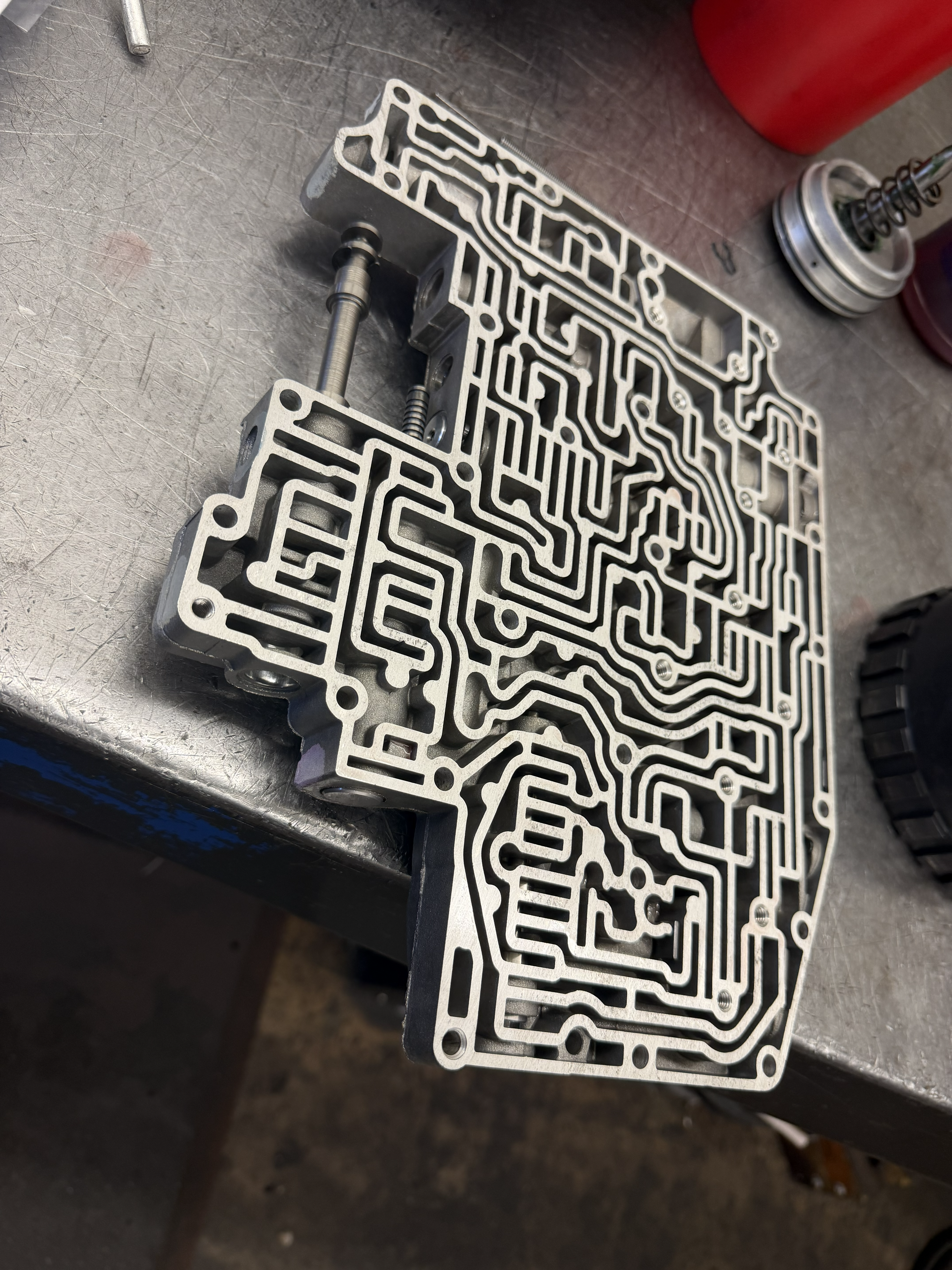 Transmission valve body and drivetrain components